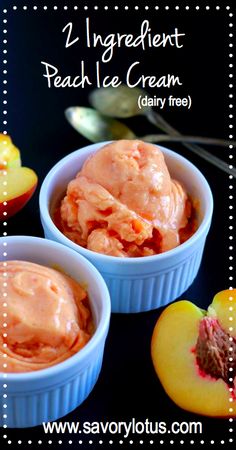 peach ice cream in small blue bowls next to sliced peaches on a black table