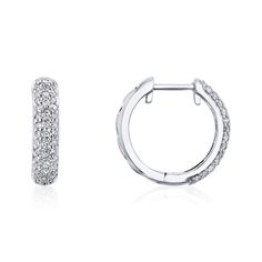 Mini Hoop Pave Earrings Not your ordinary hoops. A pair of hoop earrings is adorned with a pave of round natural diamonds halfway through the body. Each hoop's back design features a filigree for a unique look, almost like a sweet surprise only known to the wearer. 80 Round Natural Diamonds (1/2 Carat TDW) 10k White Gold Genuine Photos All photos on this product are taken in-house with real stock set with the described carat weight. Small Diamond Hoop Earrings With Pave Setting, Hoop Diamond Earrings With Pave Setting, White Hoop Diamond Earrings With Single Cut, Round Hoop Earrings With Pave Setting For Wedding, Diamond Huggie Earrings With Pave Setting, Fine Jewelry Hoop Earrings With Pave Setting, Hoop Diamond Earrings With Halo Design, Small Hoop Earrings With Pave Setting Fine Jewelry, Small Hoop Earrings With Pave Setting