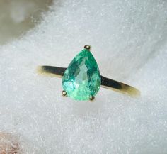 A beautiful natural earth mined emerald set in a solid 18K yellow gold setting. Marked 18K 14k Yellow Gold Pear-shaped Emerald Ring, Elegant Untreated Green Emerald Ring, Pear-shaped Green Emerald Ring, Pear-shaped Emerald Ring In 14k Yellow Gold, Fine Jewelry Emerald Ring With Pear Gemstone, Yellow Gold Pear-shaped Emerald Ring, Pear-shaped Emerald Ring, Fine Jewelry, Pear-shaped Emerald Ring In 14k Gold, Teardrop Emerald Ring In Yellow Gold