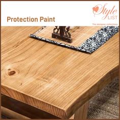 a wooden table with a black and white patch on it's edge that says protection paint