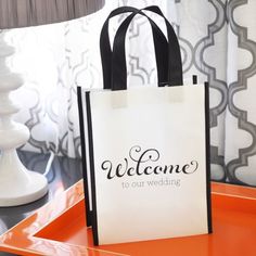 a welcome bag sitting on an orange tray