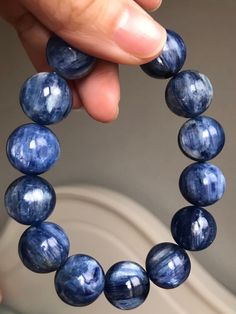 Material:Natural Kyanite beads size :  15mm   quantity: one strand 6mm approx 29 pcs one strands 7mm approx25 pcs one strands 8mm approx 22 pcs one strands 9mm approx 21pcs one strands 10mm approx 19 pcs one strands 11mm approx 18pcs one strands 12mm approx 16 pcs one strands 13mm approx 16 pcs one strands 14mm approx 15 pcs one strands 15mm approx 14pcs one strands 16mm approx 14 pcs one strands 17mm approx 13pcs one strands 18mm approx 13pcs one strands 19mm approx 12pcs one strands 20mm appro Blue Sodalite Bracelets For Gift, Sodalite Bead Bracelets As Gift, Sodalite Round Beads Bracelets As Gifts, Handmade Sapphire Color Bracelets With Round Beads, Handmade Sodalite Round Bead Bracelets, Bracelet For Friends, Kyanite Bracelet, Blue Kyanite, Beads Bracelet