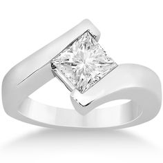 a white gold ring with a princess cut diamond