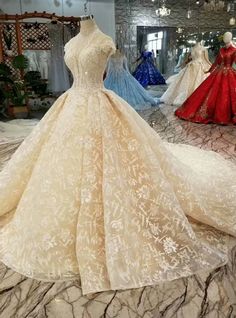 a dress on display in a store with other gowns behind the mannequin