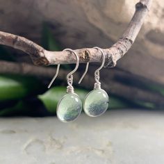 "Light Green Tint Raindrop Sterling Silver Aesthetic Earrings, Medium Size, Minimalist Jewelry, Handmade Jewely, Nature Lover Gift for Her This collection is inspired by the beauty of rain and the rainbow of colors seen in nature. This is the perfect gift for anyone that loves nature, simplicity, and a customizable look! The sparkle is subtle and simple and changes depending on the lighting and the colors behind the glass. This wanderlust, boho, hippie style earrings are the perfect gift for her Minimalist Adjustable Hypoallergenic Teardrop Earrings, Minimalist Nickel-free Adjustable Teardrop Earrings, Handmade Minimalist Teardrop Earrings For Everyday, Adjustable Nickel-free Minimalist Teardrop Earrings, Minimalist Adjustable Nickel-free Teardrop Earrings, Minimalist Teardrop Wire Wrapped Earrings, Minimalist Wire Wrapped Teardrop Earrings, Green Minimalist Sterling Silver Earrings, Minimalist Green Sterling Silver Earrings