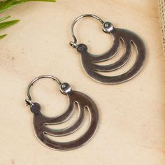 Evoking the shadows of crescents elegant openwork details these hoop earrings from Mexico. Martha Vargas creates these earrings crafted from sterling silver with a combination of finishes. Bohemian Crescent Sterling Silver Hoop Earrings, Bohemian Crescent Hoop Earrings In Sterling Silver, Bohemian Sterling Silver Crescent Hoop Earrings, Crescent Oxidized Sterling Silver Earrings, Metal Crescent Hoop Earrings, Adjustable Crescent Hoop Earrings, Adjustable Crescent Sterling Silver Hoop Earrings, Silver Crescent Hoop Earrings With Ear Wire, Sterling Silver Crescent Hoop Earrings