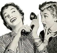 two women are talking on the telephone and one is holding her hand up