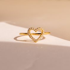 A P H R O D I T E ∙ R I N G Inspired by the goddess of love and beauty, our Aphrodite Ring is designed with glimmering diamond stones that join together to form a heart, inviting those who wear this special ring to fall in love. Simply the perfect Anniversary gift that as love grows, will become a timeless romantic keepsake ✨ * Material: High Quality Solid 925 Sterling Silver * Finish: 18K Gold * Featuring 10mm Open Heart Ring with High Quality CZ Pave Diamonds H O W ∙ T O ∙ O R D E R * Simply s Dainty Open Heart Promise Ring, Valentine's Day Halo Ring As A Gift, Valentine's Day Gift Ring With Halo Detail, Diamond Birthstone Ring, Open Heart Ring, Diamond Heart Ring, Special Ring, Goddess Of Love, Ring Dainty