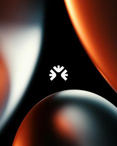 an abstract background with black and orange circles, white arrows on the bottom right corner