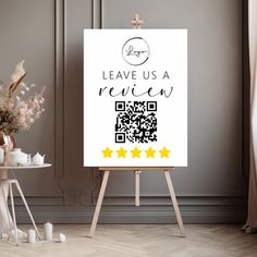 an easel with a sign that says leave us a review and three stars on it