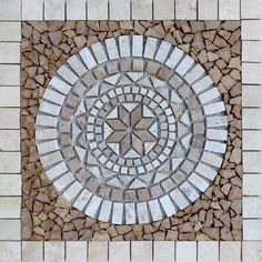 a circular pattern made out of small stones