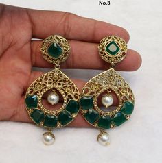 *gold finish light weight earrings set. Green Jhumkas With Stone Work, Green Dangle Chandbalis With Latkans, Green Stone Work Chandbalis For Celebration, Green Meenakari Dangle Danglers, Green Kundan Drop Dangler Earrings, Green Kundan Drop Earrings, Green Kundan Drop Danglers, Green Kundan Earrings With Stone Work, Green Kundan Earrings With Intricate Design