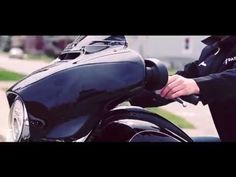 a close up of a person on a motorcycle holding the handlebars with both hands