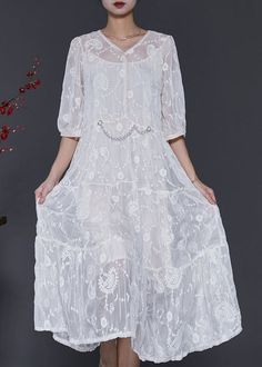 Experience elegance and sophistication with our White Silk Maxi Dress, featuring a V-neck and embroidered half sleeves. The intricate details and luxurious silk fabric make this an exclusive and stylish choice for any occasion.Fabric: Silk blendedSize... Elegant V-neck Dress With Intricate Embroidery, Elegant Embroidered Short Sleeve Dress, Short Sleeve Lace Embroidered Dress For Wedding, Short Sleeve Lace Embroidered Wedding Dress, Elegant Short Sleeve Floral Embroidered Dress, Elegant Embroidered Half-sleeve Dress, Elegant Embroidered Half Sleeve Dress, Short Sleeve Embroidered Wedding Dress, Summer Wedding Dresses With 3/4 Sleeves