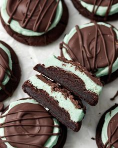 chocolate cookies with mint green cream frosting on top