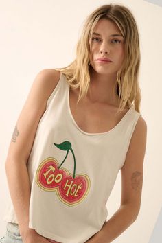 Mineral washed graphic tank top. Vintage-style cherries graphic print with "Too Hot" text. Scoop neckline with raw edge. Sleeveless with raw-edge arm holes. Scoop back. Relaxed fit. 100% Cotton. Imported top designed and printed in LA. Model wears size S. Vintage Canvas, Top Vintage, White Tank Top, Raw Edge, Graphic Tank, Scoop Neckline, Dress Accessories, Graphic Tank Top, Sweater Top