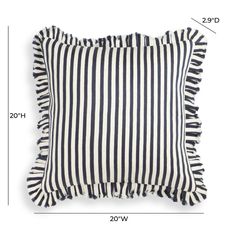 a black and white striped pillow with tassels on the bottom, measurements for each pillow