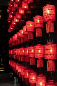 many red lanterns are hanging from the ceiling