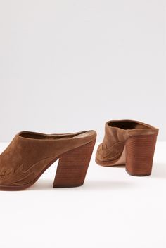 Designed with traditional Western styling, the Greta mules by Vince Camuto are crafted in soft brown suede and feature an angled stacked heel and pointed toe with a metal hardware detail. Brown Open Toe Mules With Textured Sole, Brown Woven Leather Open Toe Mules, Brown Pointed Toe Mules With 4-inch Heel, Brown Open Toe Clogs With 4-inch Heel, Brown Summer Mules With 4-inch Heel, Fall Closet, Brand Style Guide, Sock Shop, Shoe Size Conversion