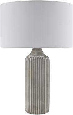 a lamp with a white shade on top of it and a light in the shape of a ribbed vase