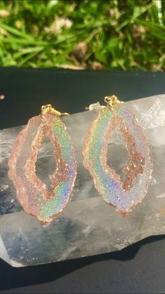 These gold holographic color shifting earrings are absolutely stunning. They are a transparent gold at a certain angle and then as soon as they shift they show a beautiful gold sparkly rainbow. They are lightweight and won't bother your ears compared to regular heavy stone *Last photo is a different color but shows the clip on option Matching necklace available, link below https://www.etsy.com/listing/856577326/holographic-geode-pendant-made-with?ref=listings_manager_grid Please note the color i Pierced Iridescent Jewelry For Party, Iridescent Pierced Jewelry For Party, Clear Pierced Jewelry For Party, Party Jewelry With Iridescent Ear Wire, Unique Gold Crystal Drop Earrings, Iridescent Party Earrings, Iridescent Pierced Drop Earrings, Iridescent Dangle Crystal Earrings For Pierced Ears, Iridescent Drop Earrings For Jewelry Making