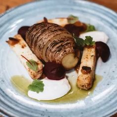 a white plate topped with food on top of a wooden table