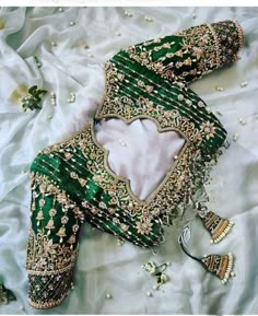 here is beautiful blouse in green colour with full of maggam work and buttas. This temple designed blouse is unique in your wardrobe Green Bridal Blouse Designs Heavy Work, Mendhi Dress, Embroidery Blouse Saree, Blouse Ideas