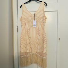 Unique Vintage Ivory Beaded Flapper Dress Large New With Tags Only Tried On. Absolutely Gorgeous Dress In Perfect Condition. Excellent For Dressy Occasions, Wedding, Bridal Party, Events, Costume Parties Etc. Size Large True To Size And Has A Little Stretch. Beautiful Fringe And Embroidery Create A Gorgeous Figure Flattering Curve Hugging Silhouette. And It’s Actually Comfortable! And You Can Wear A Bra With It. This Dress Is Perfect And Well Made. Bought For $180 And Never Got To Wear It. Now I White Sleeveless Flapper Dress For Summer, White Sleeveless Summer Flapper Dress, Sleeveless Mini Dress With Beaded Fringe For Spring, Sleeveless Beaded Fringe Flapper Dress, Embellished Sleeveless Cream Dresses, Cream Embellished Sleeveless Dresses, Cream Sleeveless Sequin Dress, Beaded Flapper Dress, Unique Vintage Dresses