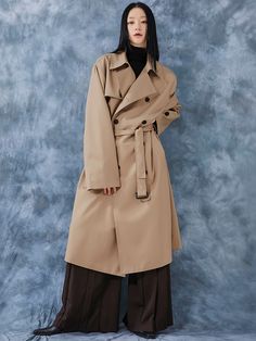 Editor's NotesFLARE UP’s trench coat features water-proof, silky fabric and oversized fit.- Button closure- Long sleeves- Button detail at cuffs- Oversized fit- Silky, water-proof fabric- Belt detail around waist- Side pocketsMeasurements(in.)0 / 1 / 2- Shoulder: 19.7in. / 19.9in. / 20.5in.- Sleeve: 24.4in. / 25.0in. / 25.6in.- Chest: 24.0in. / 24.8in. / 25.6in.- Length: 44.9in. / 46.1in. / 46.9in.*Model Info(Men): 6’2’’ Fitting Size 1,2*Model Info(Women): 5’9’’ Fitting Size 2*Model Info(Women): Oversized Business Outerwear With Button Cuffs, Classic Oversized Outerwear With Belted Cuffs, Oversized Double-breasted Outerwear With Belted Cuffs, Solid Gabardine Raincoat For Workwear, Oversized Long Coat With Belted Cuffs, Gabardine Raincoat For Workwear, Oversized Outerwear With Belted Cuffs For Work, Oversized Belted Gabardine Outerwear, Oversized Beige Outerwear With Belted Cuffs