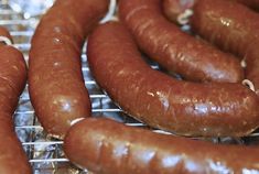 several sausages on a cooling rack ready to be cooked