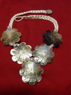 "This Necklace Flowers carved out of mother of pearl shells. MEASUREMENTS -- Shell is 2.25\" or 2 1/4, cord is up to 21\" long. Please let us know about your measurement. It is accented with white freshwater pearls. OPTION-- This necklace is also available in white cord and black pearls :) Guaranteed fast shipping!" Handmade Mother Of Pearl Shell Necklaces, Handmade Shell-shaped Mother Of Pearl Necklaces, Handmade Mother Of Pearl Shell-shaped Necklaces, Handmade Mother Of Pearl Shell-shaped Necklace, Handmade Mother Of Pearl Necklace In Shell Shape, Artisan White Mother Of Pearl Jewelry, Artisan Shell Necklace With Mother Of Pearl As Gift, Handmade Adjustable Mother Of Pearl Necklace, Traditional Handmade Mother Of Pearl Necklaces