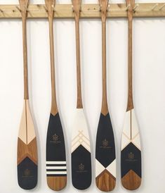 four paddles are hanging on the wall