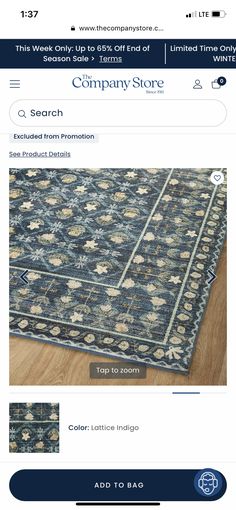 an image of a blue rug on the webpage for a company called carpet store