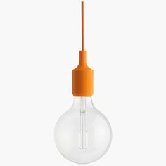 an orange light bulb hanging from the ceiling