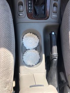 the interior of a car with two air freshener dispensers in it