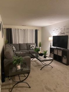 a living room filled with furniture and a flat screen tv