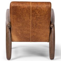 a brown leather chair with wooden legs and armrests on an isolated white background