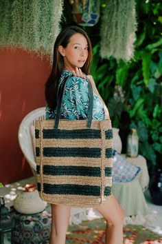 Fun handwoven oversize stripe pattern premium raffia tote featured in a slouchy silhouette with leather shoulder straps and a spacious interior compartment for day to day wears. We love pairing them with our handwoven bucket hat in black stripe color for an effortless , but stylish look at the beach. Leather handle. Dimension: 13.5"W x 17"H x 3.5"D and 10.5" handle drop. (34cm W x 43cm H x 9cm D and 27cm handle drop). Material: Premium Raffia. Pear Shaped Pendant, Cotton Throw Blanket, Summer Tote, Straw Tote, Style Expert, Beach Tote, Etsy Fashion, Black Stripes, Leather Handle