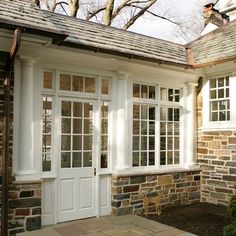 a house with two white doors and windows