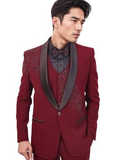 Maroon Hand Embroidered tuxedo suit includes everything you need for a polished and put-together look. It consists of a jacket, vest, pants, shirt, and a matching bowtie. The classic 2-button jacket features a tailored fit, ensuring a sharp silhouette and a touch of modern flair. The suit is made from a rich maroon polyester fabric that not only looks regal but also feels incredibly comfortable against your skin.  Whether you're attending a wedding, a black-tie event, or a formal dinner, this tuxedo suit is versatile enough to suit any occasion.  The set includes black dress shirt and a matching bowtie to complete your ensemble. The trousers feature a classic design with a traditional bottom, offering a timeless look and comfortable wear. This Men's Stylish 2-Button Tuxedo Suit is designed Designer Festive Party Suits, Designer Festive Unstitched Suit For Semi-formal Occasions, Festive Party Wear Formal Blazer, Designer Formal Festive Sets, Festive Formal Party Wear Blazer, Tailored Sets For Formal Festive Occasions, Tailored Festive Sets For Reception, Luxury Suits For Semi-formal Festive Occasions, Luxury Suit For Festive Semi-formal Occasions