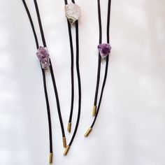 "Amethyst bolo tie features amethyst stone suspended from black color waxed cotton cord. Brass tips finish off the cords.  About 34\" cord is halved and hangs near belly button--about 16-17\" below neck. Select exact stone you want. Price is per necklace. Stone is about .75\"" Bolo Ties, Necklace Stone, Bolo Tie, Tie Accessories, Purple Wedding, Amethyst Stone, Cotton Cord, Suit And Tie, Waxed Cotton