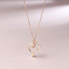 Love is Never Ending: Classic heart pendant design, the necklace is the best choice to show your love and gift for women and girls. Set a diamond in the middle of the heart pendant to look more luxurious. Wearing it, you will be the focus on any occasions. Materials: 14K Solid Rose Gold and Diamond. Pendant Size: 16*13MM. Chain Length: 16"+2" Extender for Adjusting. Weight: Total 1.68g. Personalized Rose Gold Diamond Necklace, Rose Gold Diamond Heart Necklace With Charm, Rose Gold Heart Necklace With Clavicle Chain For Anniversary, Elegant Open Heart Diamond Necklace For Valentine's Day, Luxury Rose Gold Heart Necklace For Anniversary, Elegant Double Heart Diamond Necklace For Gift, Rose Gold Diamond Heart Pendant Necklace, Rose Gold Diamond Necklaces For Valentine's Day, Rose Gold Heart Pendant Diamond Necklace