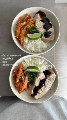 two white bowls filled with rice and meat covered in sauce on top of a table