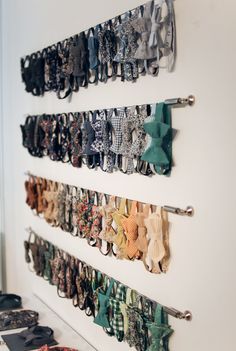 there are many pairs of shoes hanging on the wall