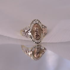 14k Oval Shaped Virgin Mary Ring / Blessed Mother Ring / Diamond Cut Religious Rings / Mother Mary Gold Ring / Gift For Her FEATURES @ Made to Order @ Materials: 14K  @ Avg Weight: 2.67g @ Gemstone: None @ Handmade in the USA SIZING If you need assistance with your ring size, just hit the "Message CherVenue" button and we will get back you within a few hours. RETURNS & EXCHANGES  I gladly accept returns, exchanges, and cancellations Contact me within: 7 days of delivery Ship items back within: 1 Gabi Demartino Wedding Ring, Luxury Vintage Rings For Memorial, Princess Mary Ring, Luxury Vintage Rings For Memorials, Oval Ring With Hallmark For Anniversary, Gold Oval Ring With Hallmark, Vintage Gold Ring With Halo, Oval Hallmarked Ring For Gift, Oval Hallmarked Ring As Gift