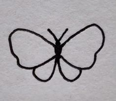 a drawing of a butterfly on a white towel with black lines in the shape of a butterfly