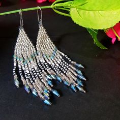 Wedding Long Fringe Earrings.Silvery And White Color. Silver blue Crystals Earrings. Sparkling, Gentle Seed Beads, Indian Jewelry. Beautiful Gift For Women. Gradient long fringe bead tassel earrings . Gradient bead Waterfall earrings.Boho style Seed Beads earrings.Long dangle earrings. Beautiful, Elegant Earrings .A beautiful Christmas gift for women and girlfriend. These are long but not heavy earrings. Length of earrings 12cm (4 inches). Width of earrings 0.78 inches. To create these earrings Silver Teardrop Beaded Jewelry, Silver Chandelier Earrings With Round Beads And Ear Wire, Silver Chandelier Earrings With Round Beads, Blue Dangle Earrings With Silver Beads, Silver Teardrop Beaded Earrings As Gift, Silver Teardrop Beaded Earrings For Gift, Silver Beaded Drop Earrings For Party, Silver Beaded Chandelier Earrings For Gifts, Silver Beaded Long Drop Chandelier Earrings