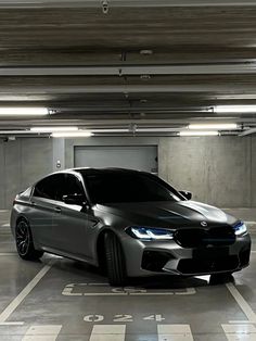 a grey car parked in a parking garage