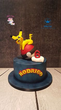 a cake that is sitting on top of a table with the name rodrico