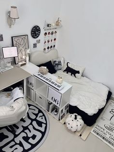 a white room with black and white decorations on the walls, furniture and rugs